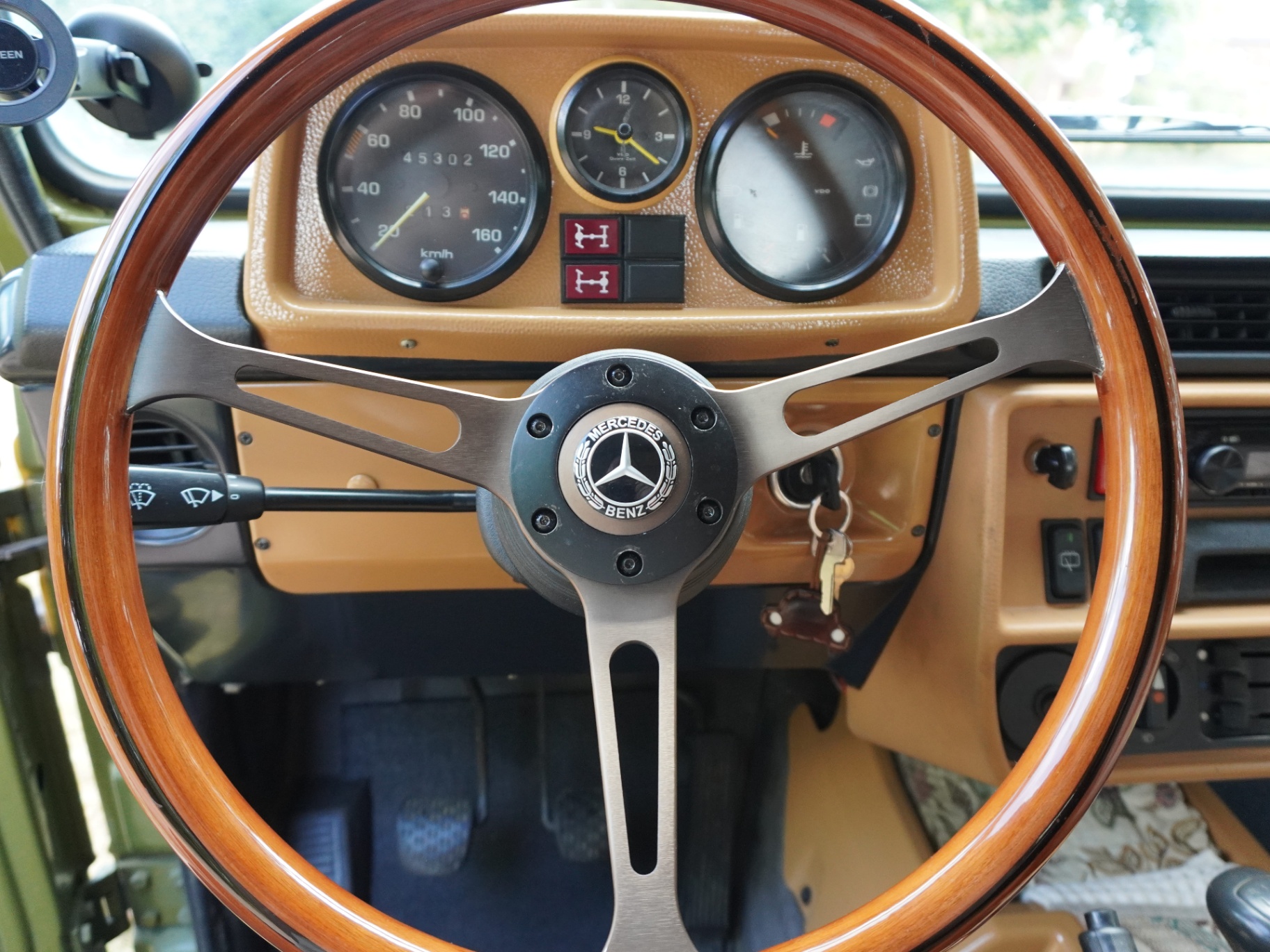 Wood steering wheel and three-dial cluster