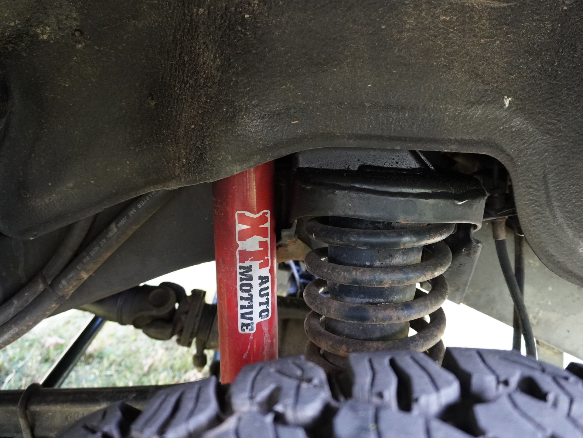 XT Automotive shock absorber and coil spring, front axle