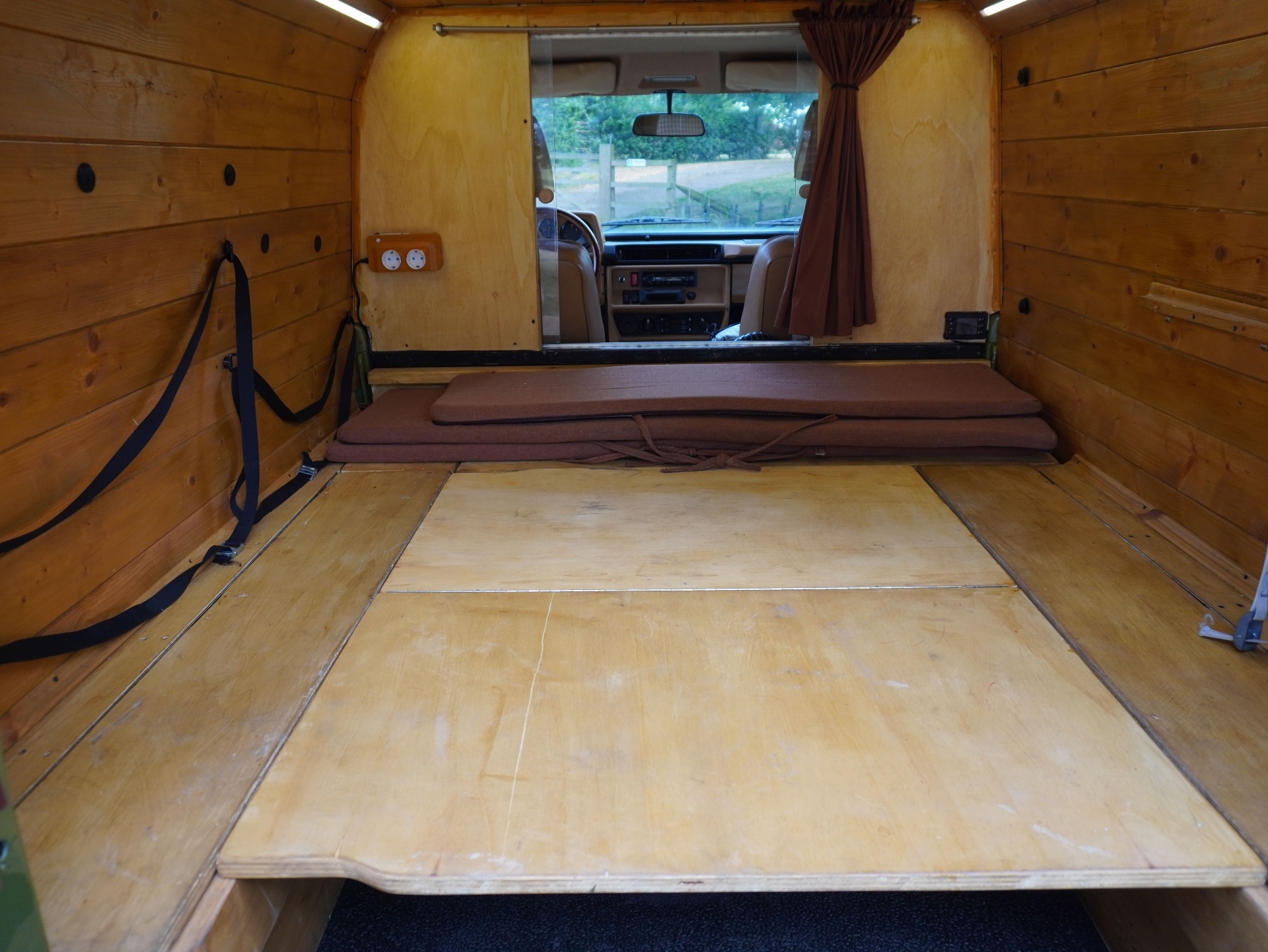 Rear cabin with bed platform folded out, view to cockpit